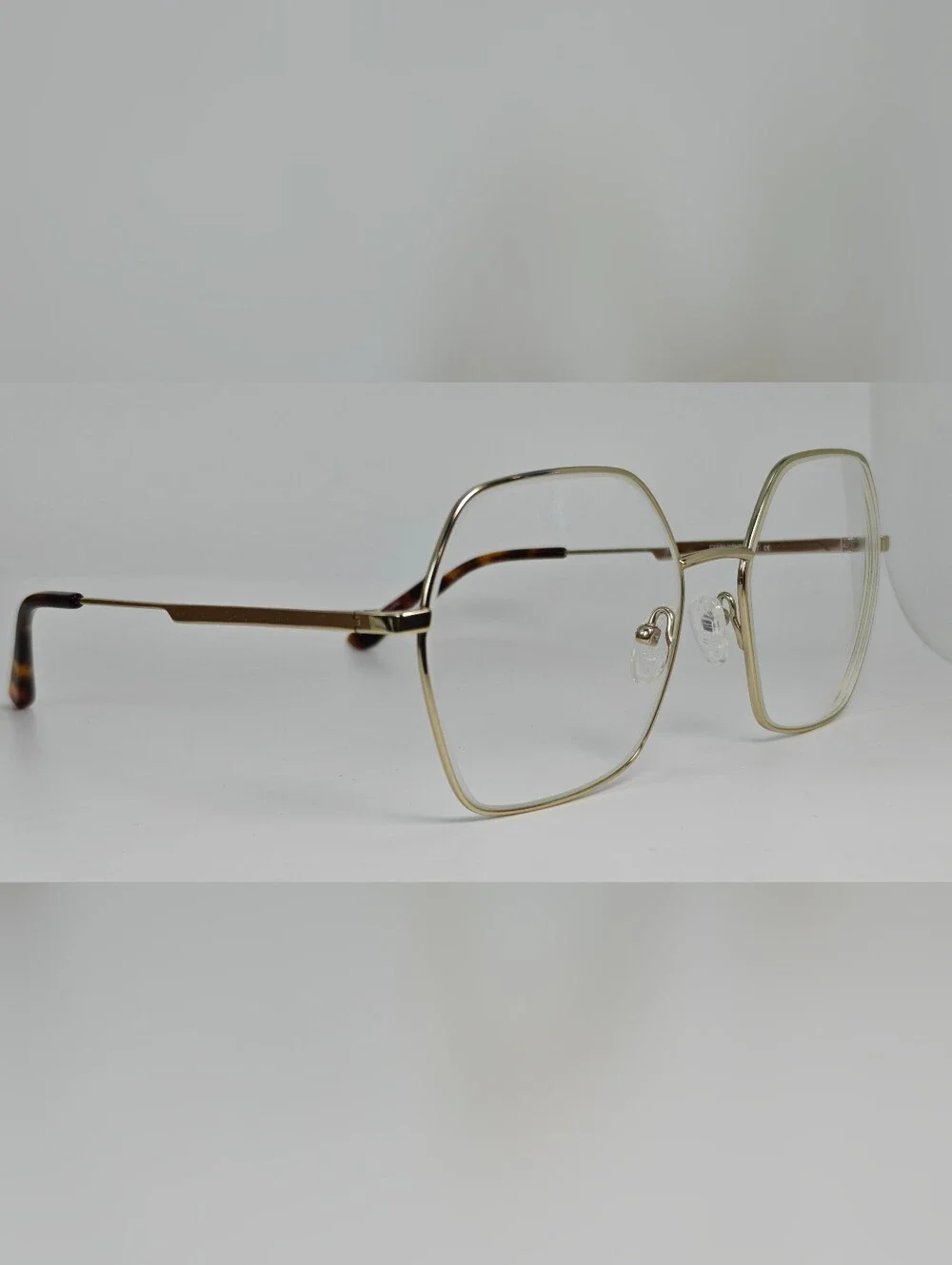 Elixir. Titanium.Gold Polygon. Metal Frame Women's Eyewear.